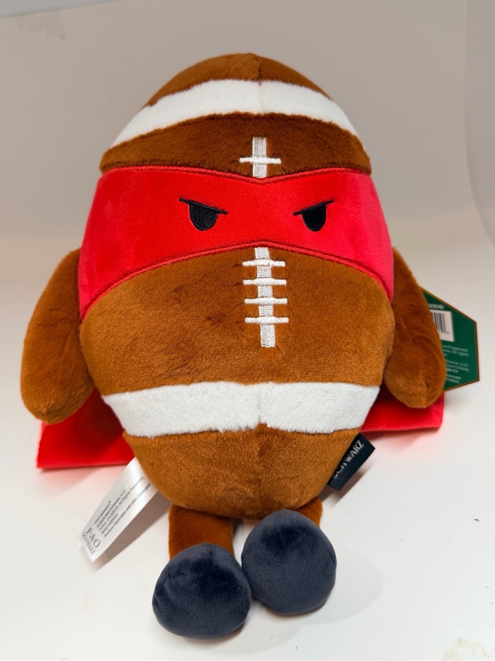 FAO Schwarz Brown Plush Football with Red Mask and Black Feet